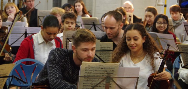 tom helping child crop.jpg